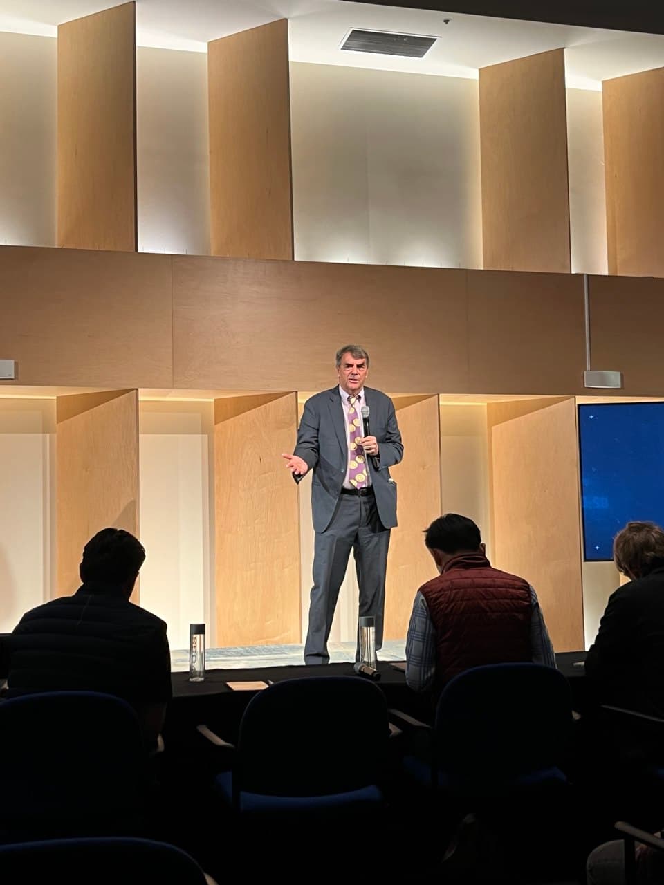 Tim Draper speaking on stage